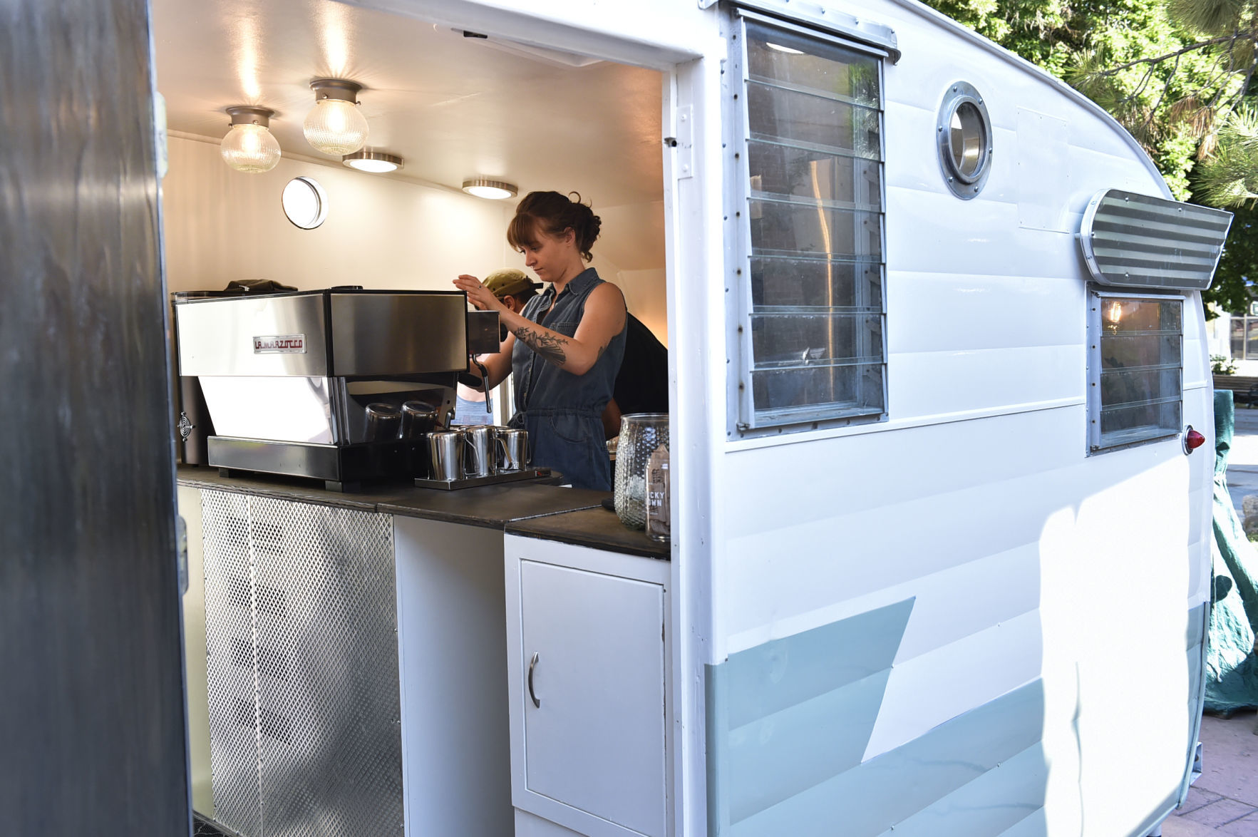 Rachael Weidlich and Steven Ladefoged make espresso drinks